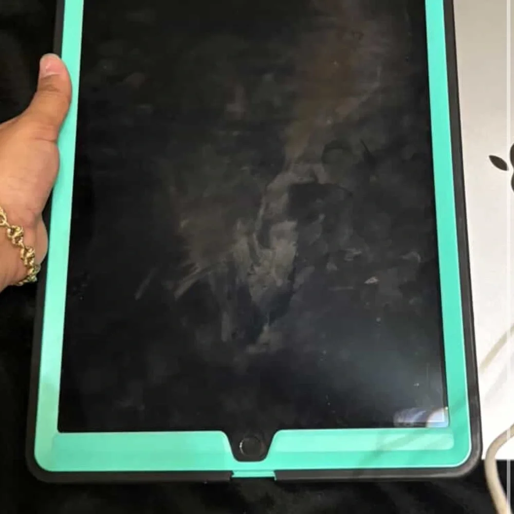 Apple Tablet with Black and Green Case